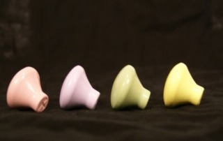 Painted wooden knobs in a variety of colors, available in custom shapes and finishes.
